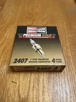 (4) Champion 2407 Premium Gold Spark Plugs. Fixed Price $5.00.