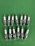 Lot Of 13 Champion Spark Plugs For QL82YC. Fixed Price $59.00.